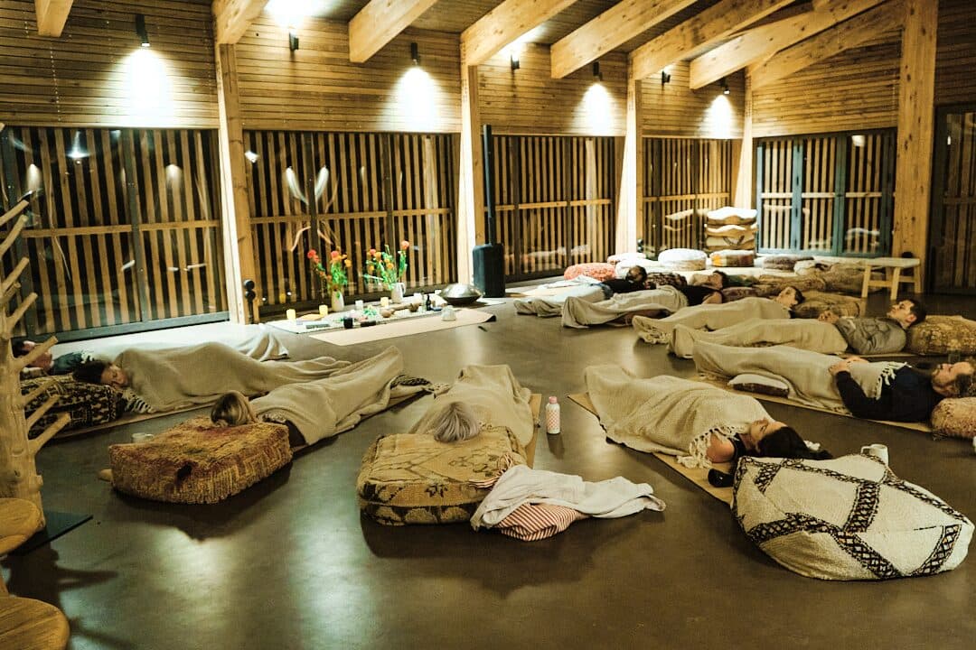 Group breathwork session at an evening retreat